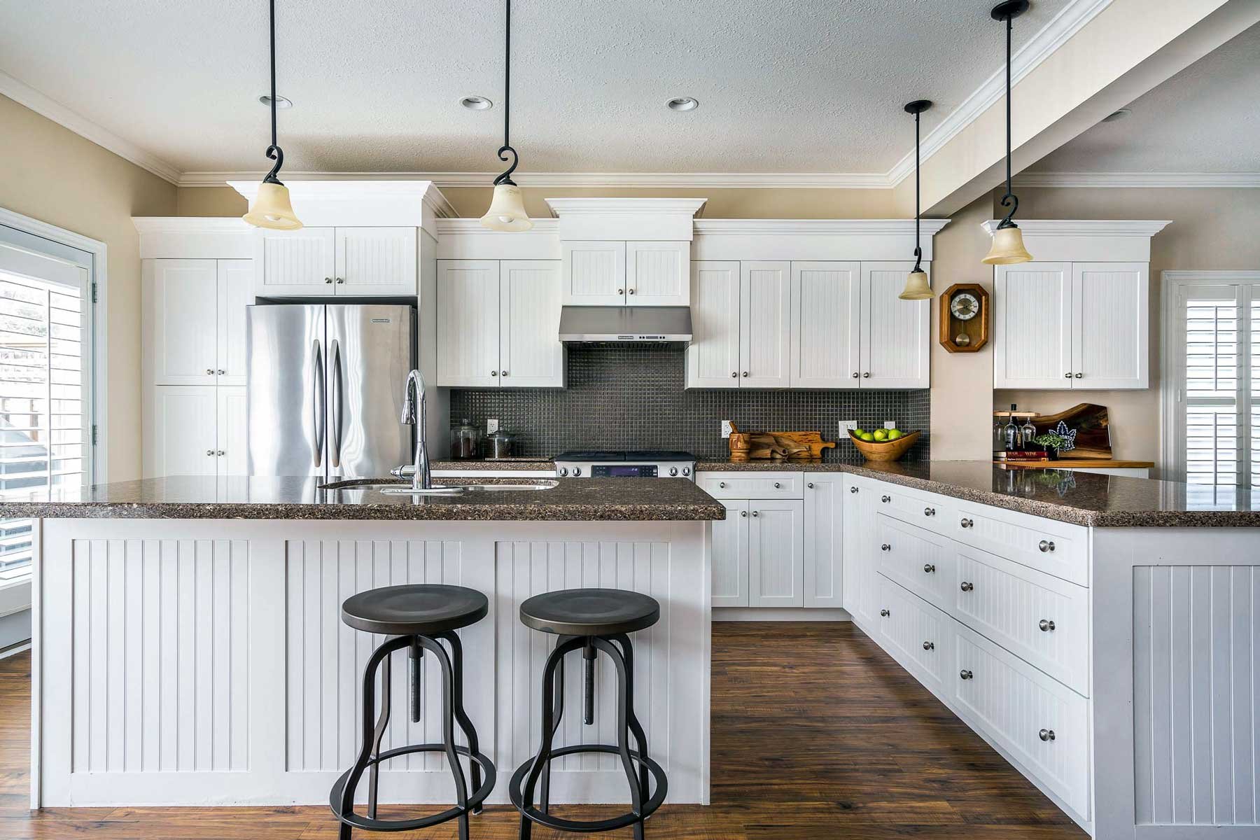 A white kitchen from a recent real estate photo shoot in Collingwood, Ontario. This was shot with the lights off by Sebastian, a photographer at Elevated Photos.