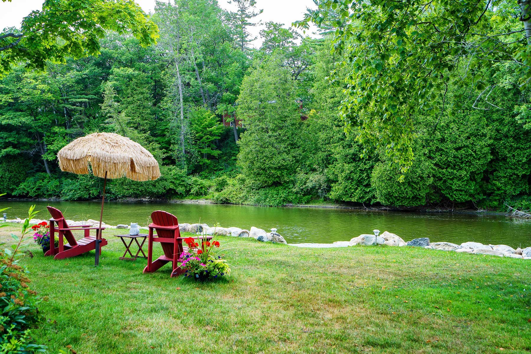 A backyard of a real estate listing situated on the Nottawasaga river in Wasaga beach.