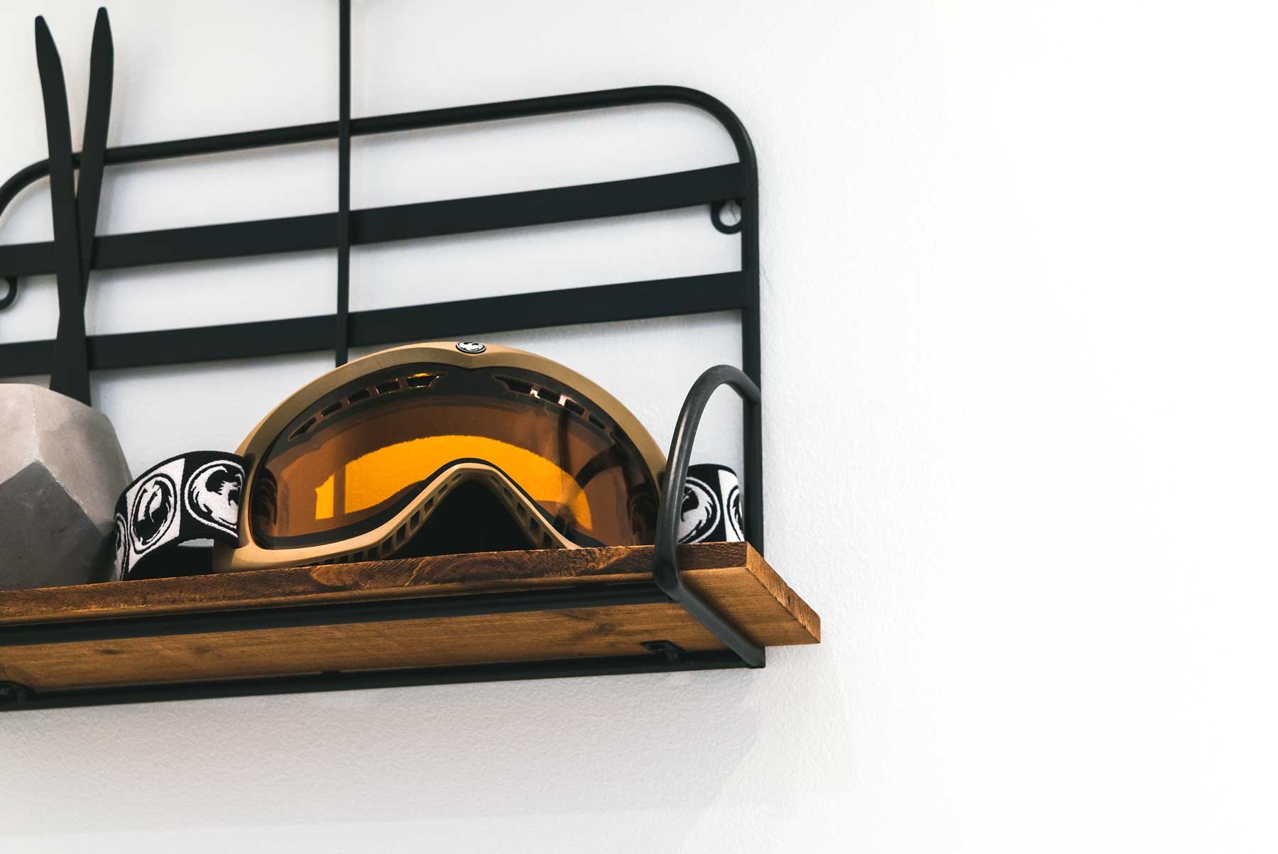 Ski goggles on a shelf at a chalet in the blue mountains, Ontario.