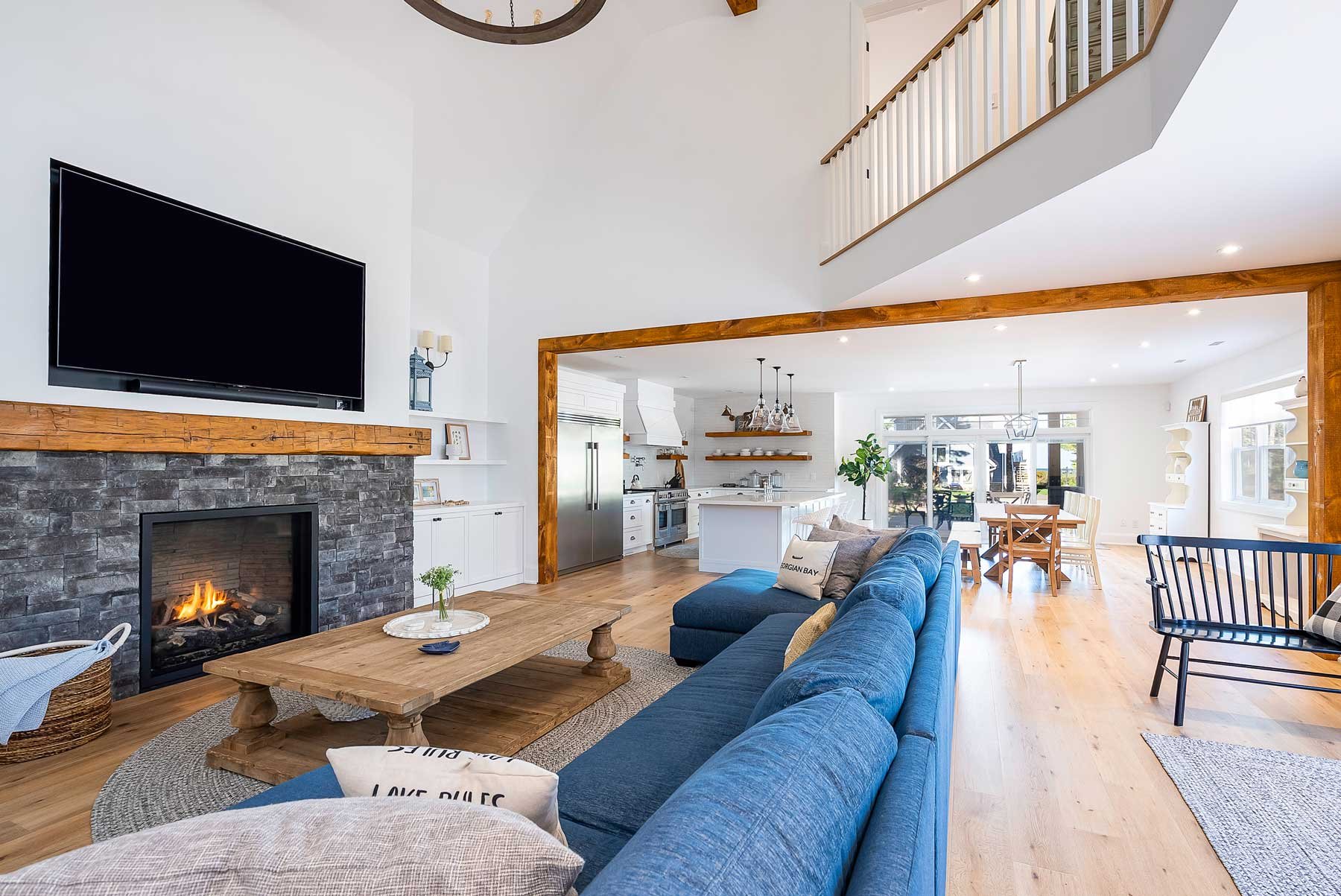 A large open concept home with living room and kitchen in Wasaga Beach, Ontario. This was shot during a real estate photo shoot.