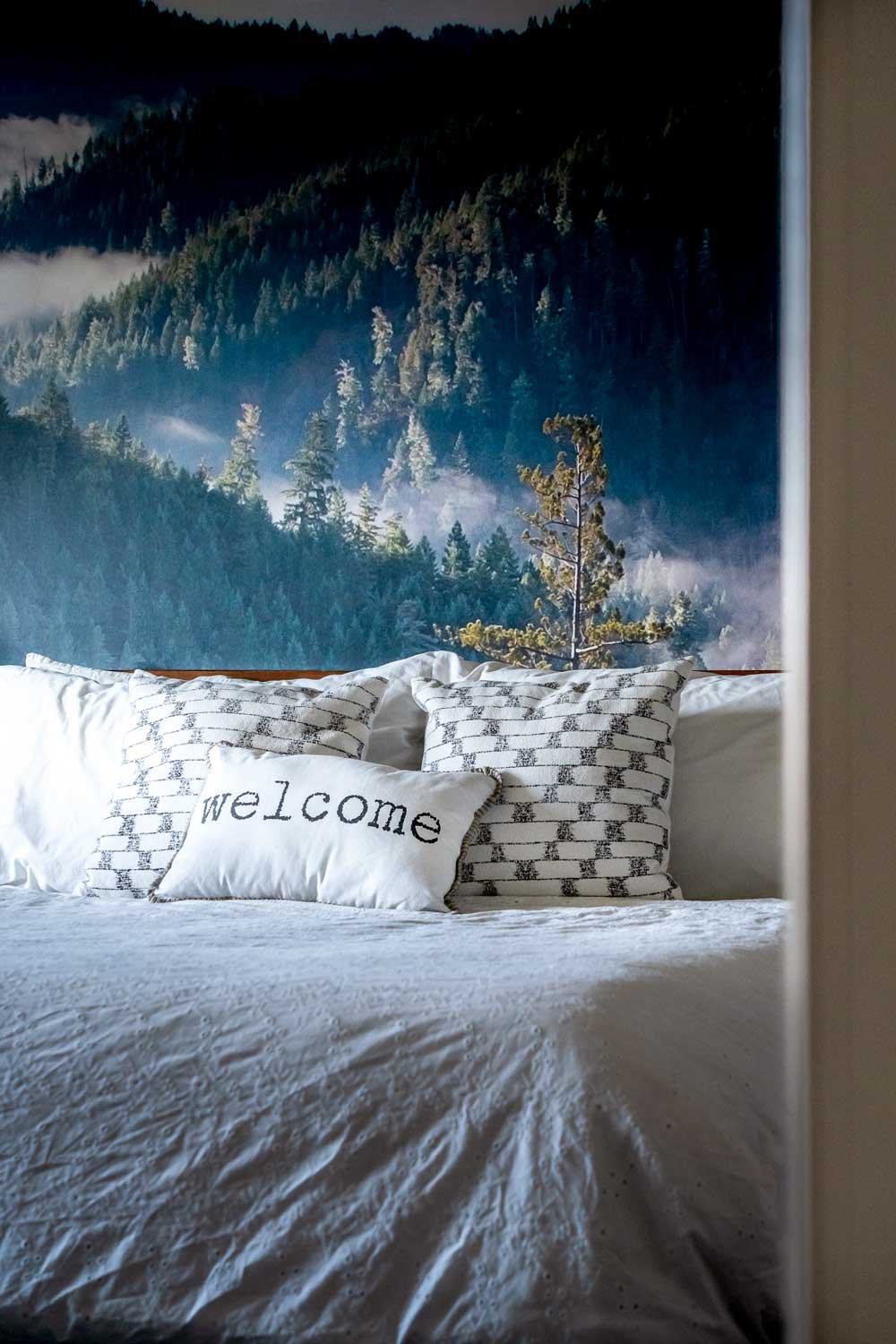 A pillow that says, welcome, photographed at an Airbnb rental in the blue mountains.
