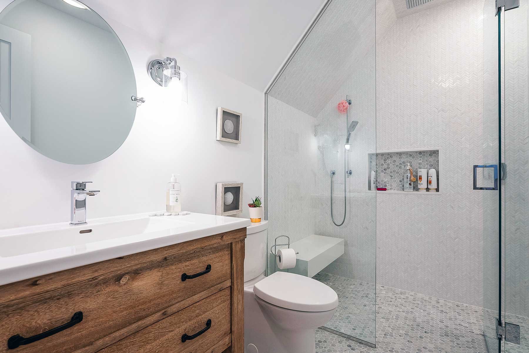 A white bathroom and shower.