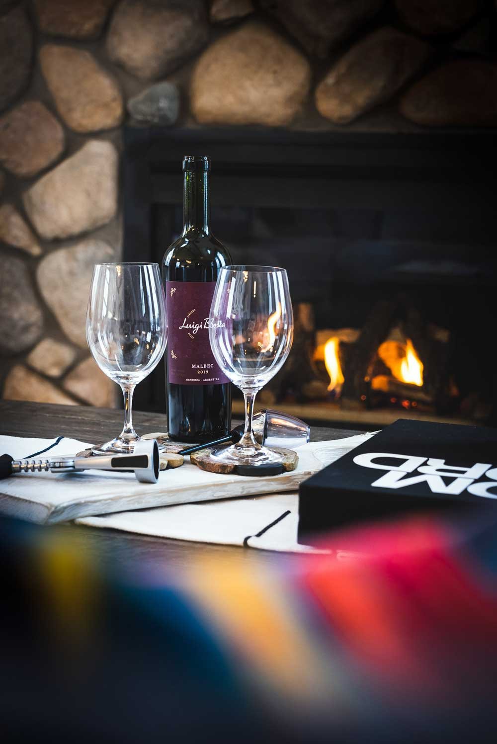 Wine and a fireplace in The Blue Mountains, Ontario at an AirBnb.